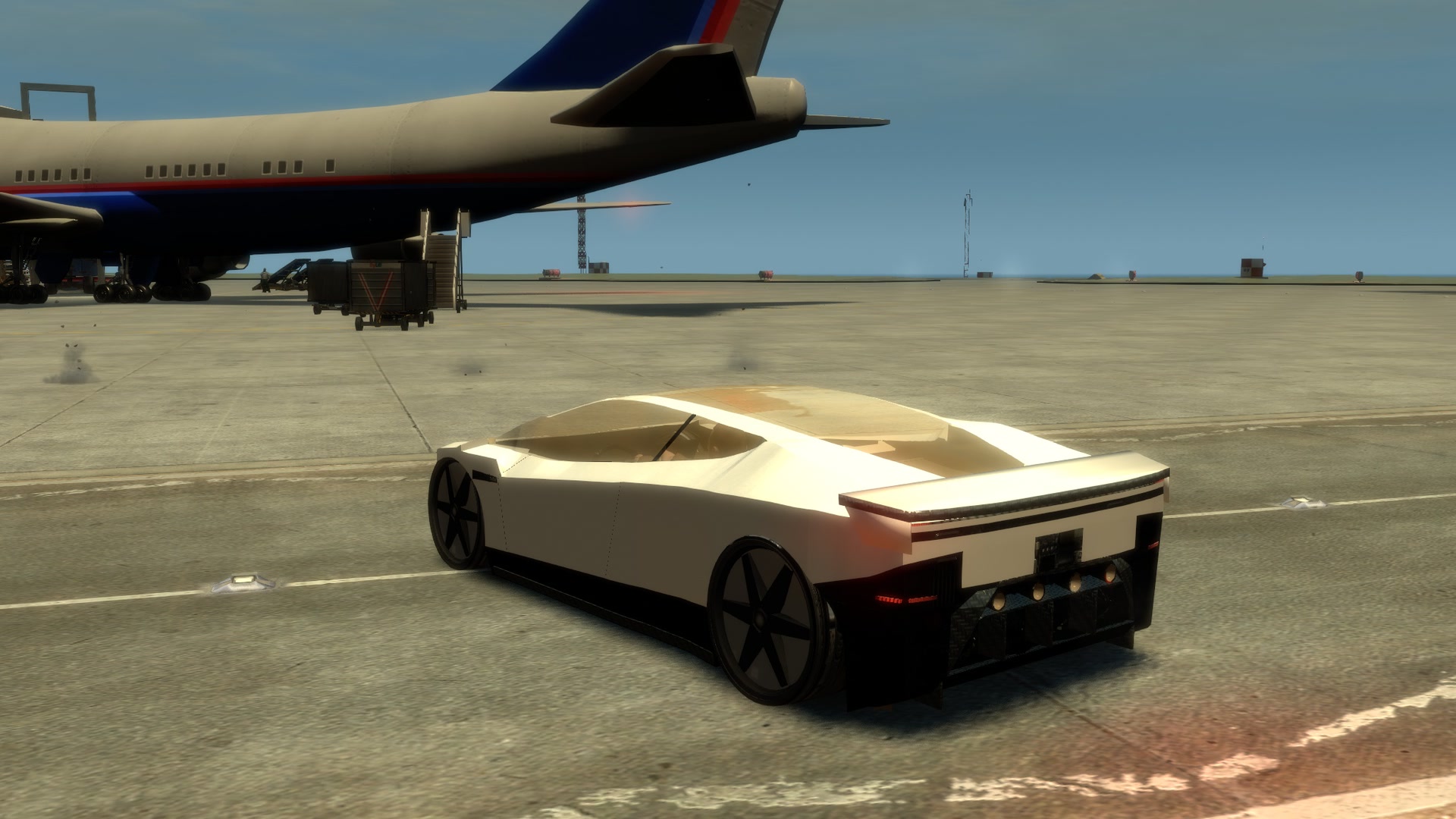 Rear three-quarter: light bar, diffuser and the four rear thrusters