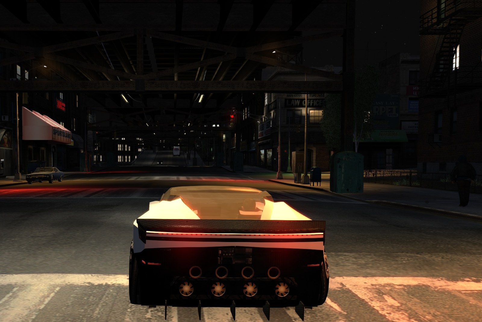 Roadster X in the game at night, driving under the elevated railway