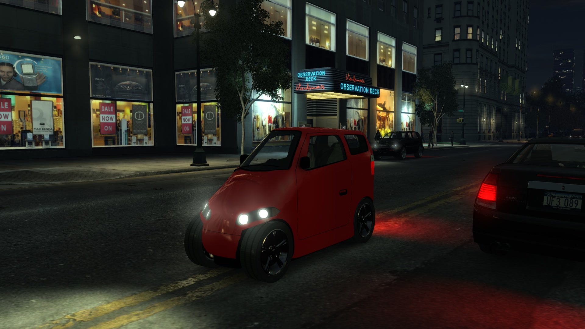 Night in midtown, headlights on
